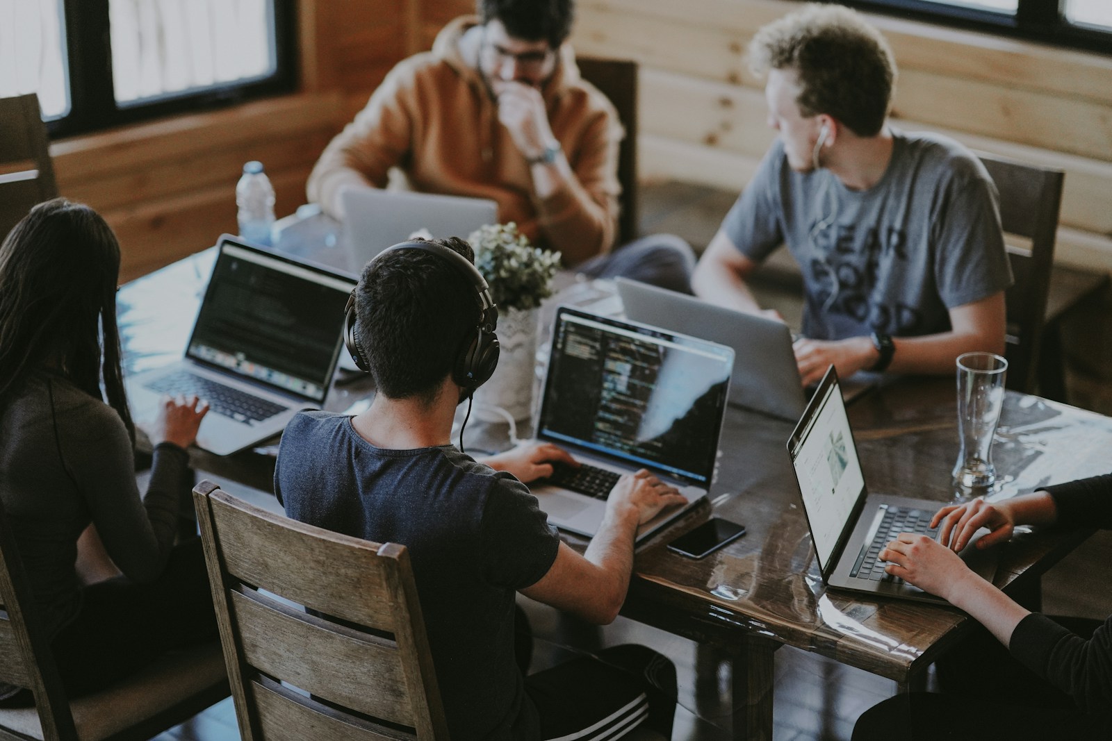 People comparing work together around a table